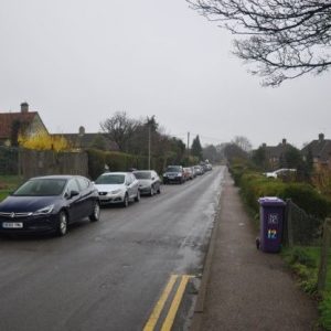 Cars parked along Briary Lane – 183m